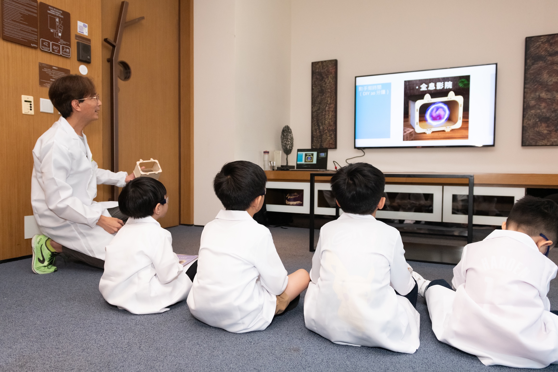 Watching the TV for instruction.